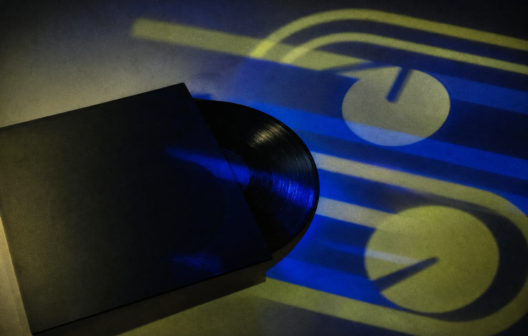 A grainy cut-paper editorial still life of an unlabeled vinyl record beside looping chart bars and two clock-like circles in cobalt and acid green.